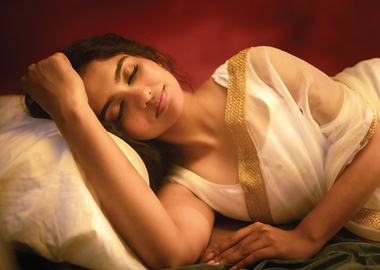 mamitha baiju sleeping on a pillow