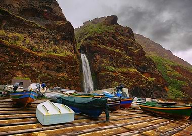 Boats at the base of a waterfall, Madeira