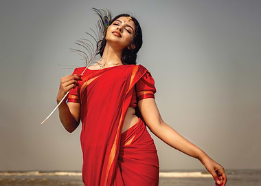 mamitha baiju in Red Saree with Peacock Feather