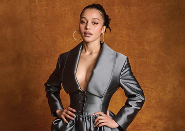 chase infiniti in a dramatic grey outfit