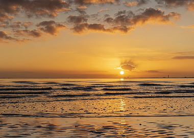 Sunset over the ocean with clouds