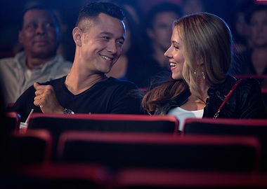 Couple laughing in movie theater
