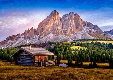 Rustic cabin in the mountains at sunset
