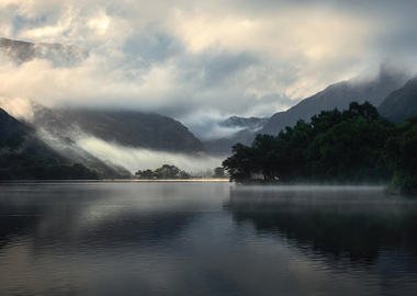 Misty Mountains Reflecting in a Calm Lake