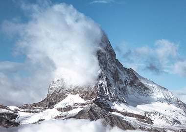 Majestic Mountain Peak in Clouds