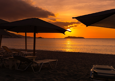 Beach Sunset with Umbrellas and Loungers