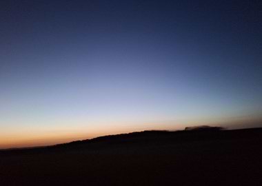 Twilight Horizon Over Rolling Hills