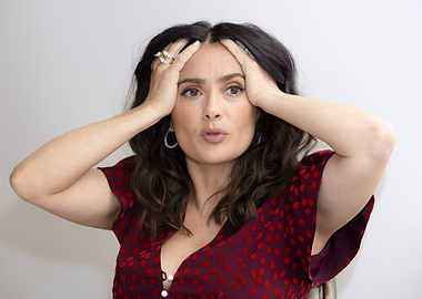 Salma Hayek with hands on head