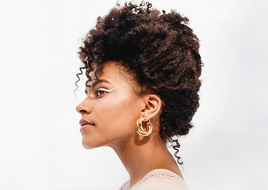 zazie beetz with Afro and Gold Earrings