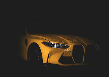 Yellow sports car with water droplets