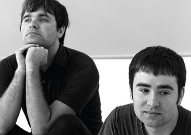 the postal posing for a photo