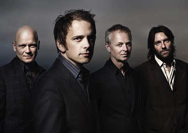 tord gustavsen band in suits posing