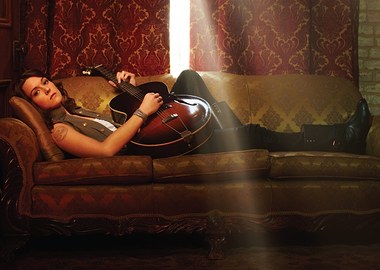 brandi carlile with Guitar on Sofa