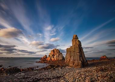 Dramatic coastal rock formations at sunset