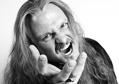 iced earth with long hair and mustache