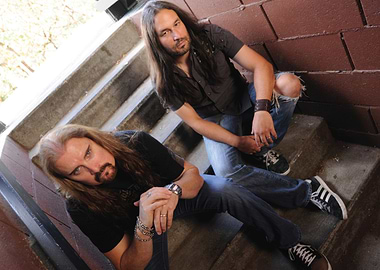 james labrie with long hair on stairs