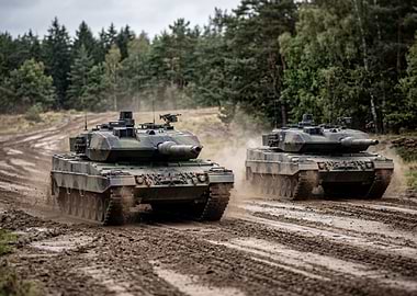 Two Leopard 2 tanks on a dirt road