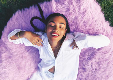 olivia dean relaxing on a purple rug