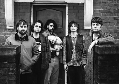 Band Poses Outside Brick Building fontaines dc