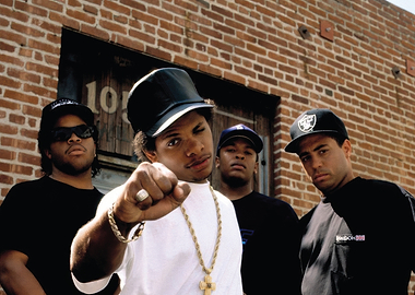 N.W.A. posing in front of a brick building