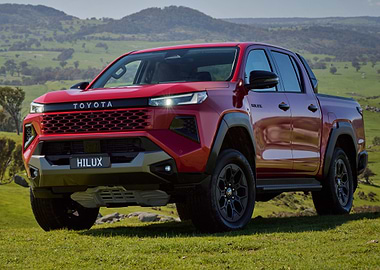 Red Toyota Hilux Truck in Nature