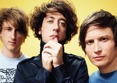 Three men posing for a photo