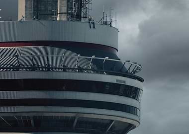 Man sitting on top of a tower
