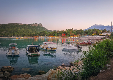 Boats on a tranquil bay at sunset