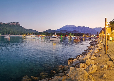 Twilight Harbor with Boats and Mountains