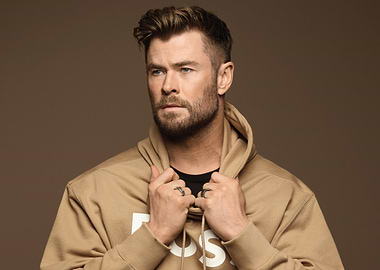 Chris Hemsworth in a tan hoodie