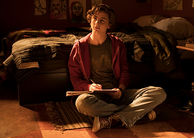 Young man writing in a notebook