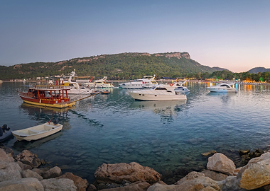 Boats in a tranquil bay at dusk