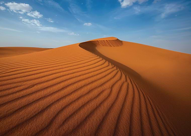 Desert Sand Dunes Under Blue Sky