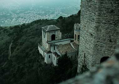 Castle on a cliff overlooking a city