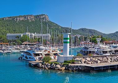 Marina with Lighthouse and Mountain Backdrop