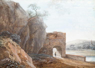 Man walking through ancient ruins by a river
