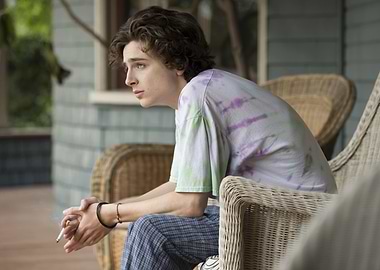 Timothée Chalamet smoking on a porch