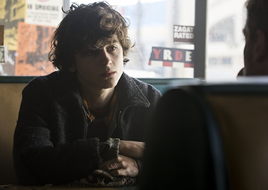 Young man in a diner booth