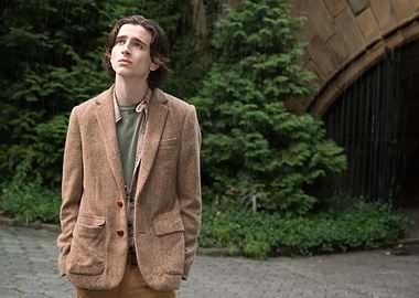 Young man in tweed jacket in the rain
