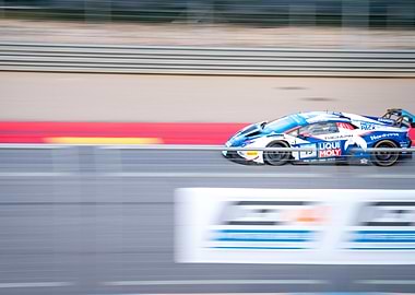 Race Car Speeding on Track