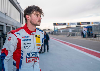Race car driver in racing suit