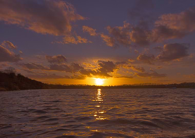 Sunset over the calm and serene Beeby's Lake, Peterborough, UK