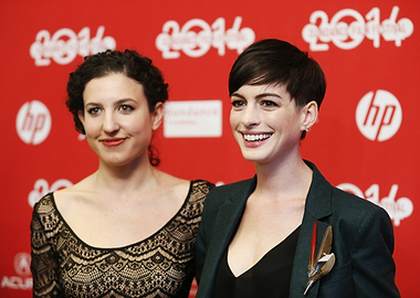 Anne Hathaway and another woman on red carpet