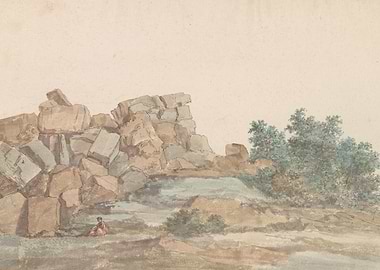 Person sitting by large rocks and trees