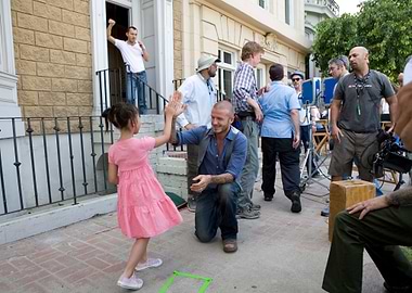 David Beckham and a young girl high-fiving