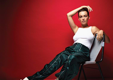 emma mackey in white tank top and green pants