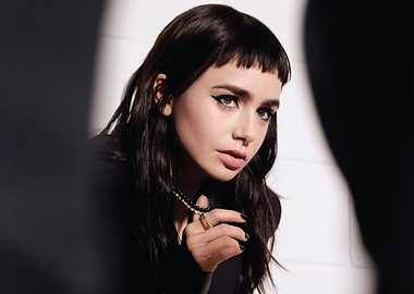 lily collins with dark hair and bold makeup