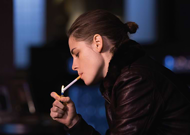 Kristen Stewart lighting a cigarette