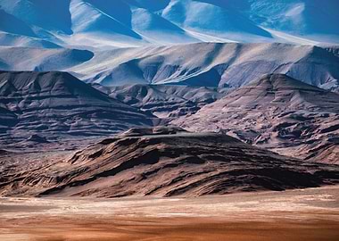 Layered Desert Mountains Under Blue Sky