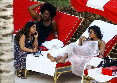 Celebrities relaxing by the pool